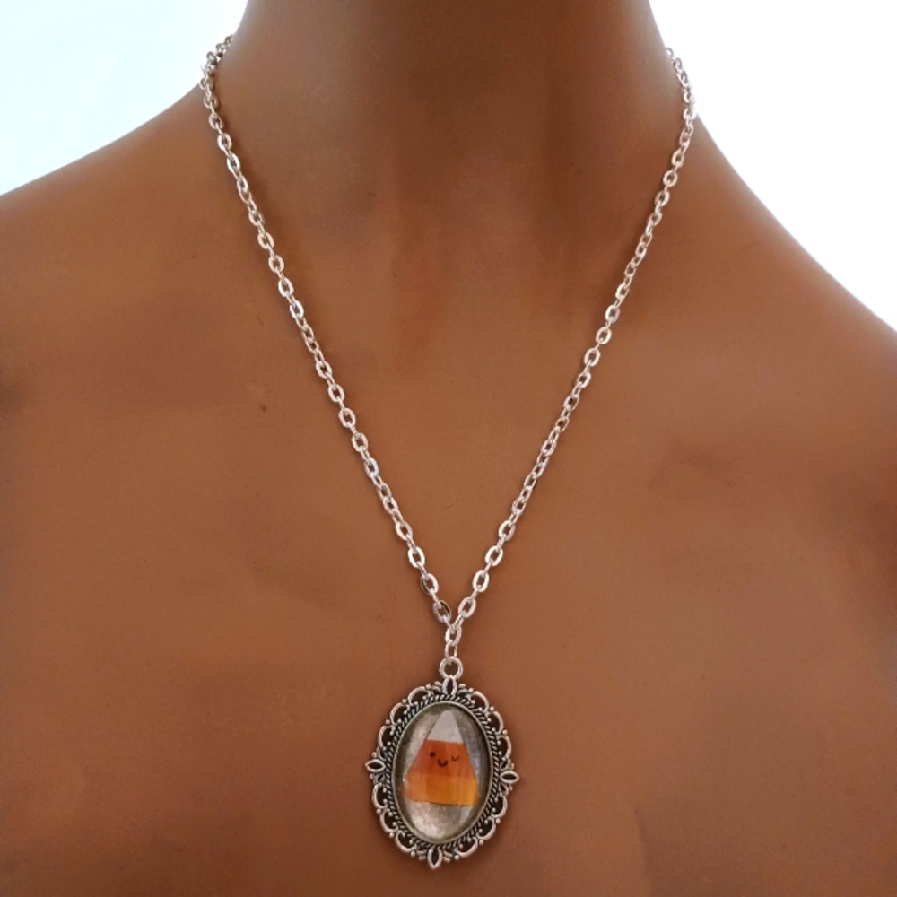 Happy Winking Candy Corn Pendant in Silver Frame.